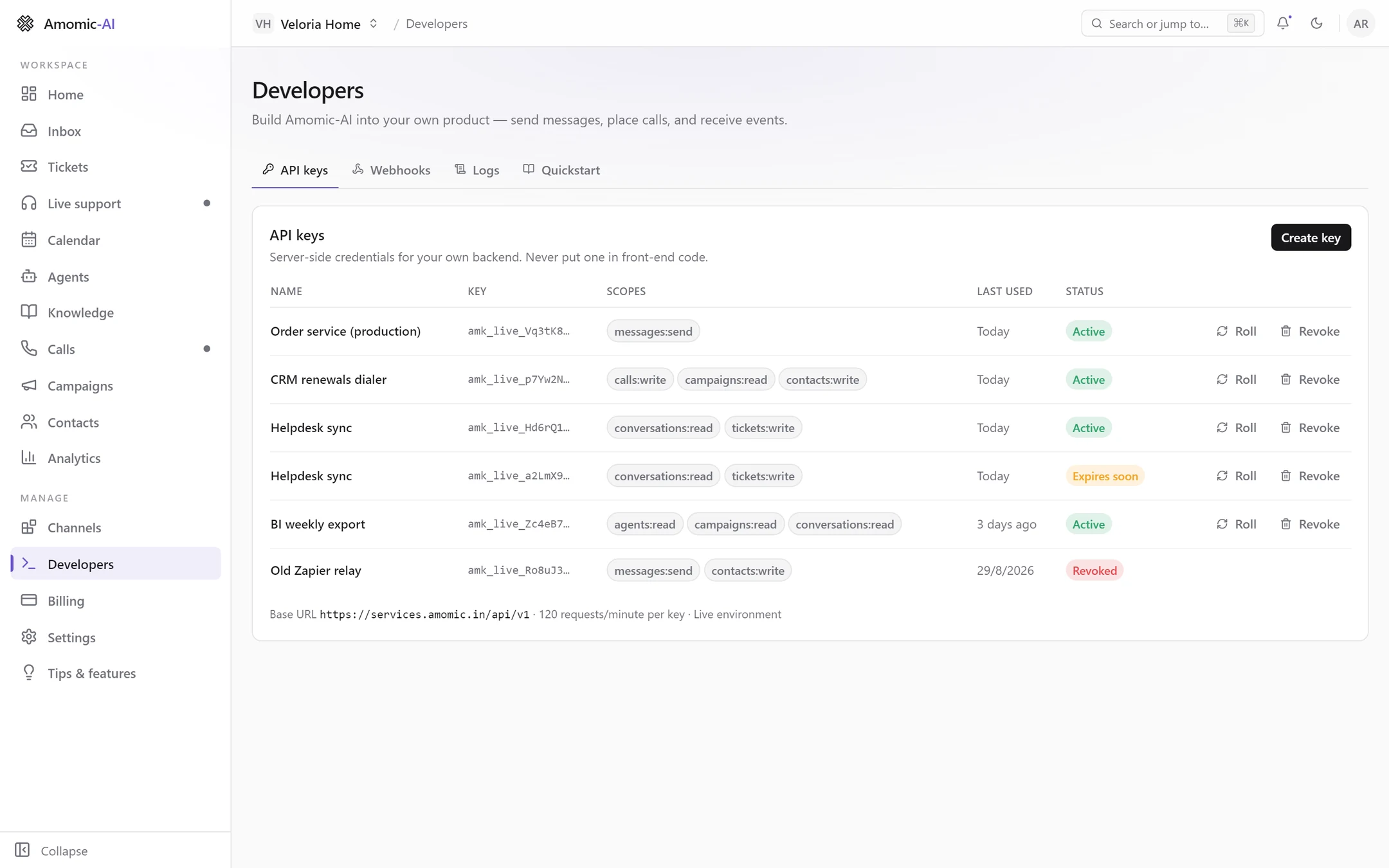 The API keys tab listing keys with masked prefixes, scope badges, last used dates and Active, Expires soon and Revoked statuses, with Roll and Revoke buttons and the base URL footer